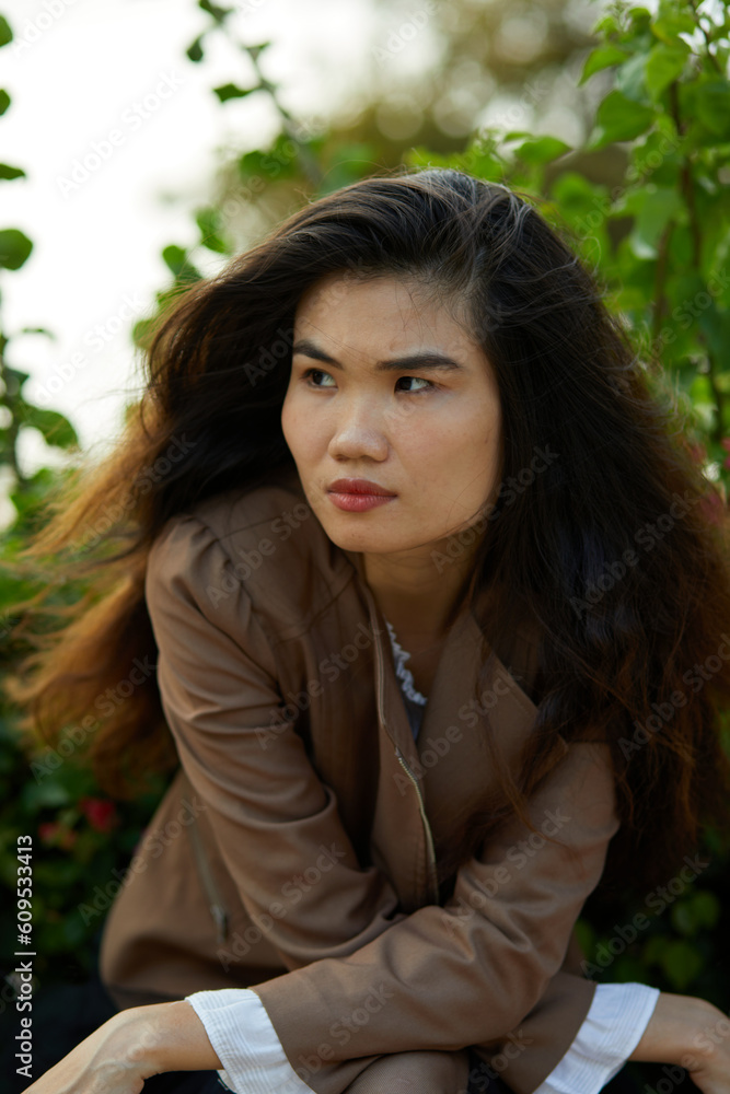 Vietnamese woman in the park during lunchtime in Vietnam. Vietnamese woman in the park during lunchtime in Vietnam.