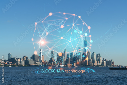New York City skyline of Financial Downtown, Hudson River waterfront, skyscrapers at day time. Manhattan, USA. Decentralized economy. Blockchain, cryptography and cryptocurrency concept, hologram