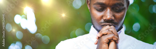 African man prayer in white shirt pray and faith in christianity religion photo