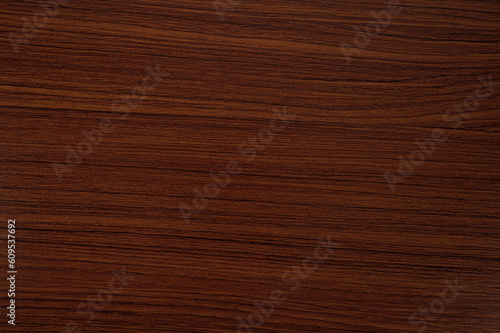 Reddish brown wood grain background.