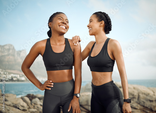 Fitness friends laugh at beach, women workout together with happiness and active lifestyle outdoor. Exercise in nature, healthy and happy with female people have funny conversation while training