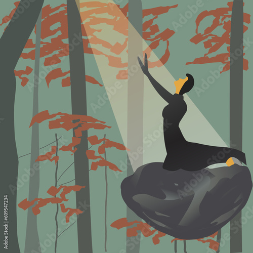 woman is praying or meditating in the autumn forest