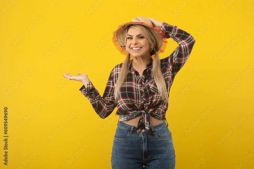 Beautiful brazilian woman, with festa junina clothes, on yellow background Beautiful brazilian woman, with festa junina clothes, on yellow background