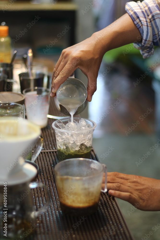 barista making a cup of coffee in the coffee shop barista making a cup of coffee in the coffee shop