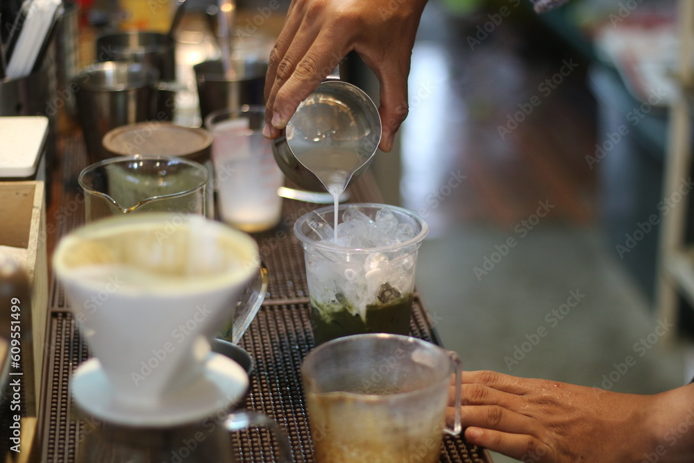 barista making a cup of coffee in the coffee shop barista making a cup of coffee in the coffee shop
