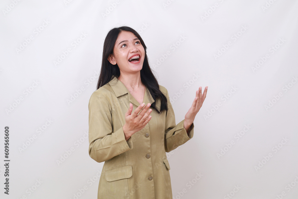 Wow expression of young indonesian government employee receiving or getting something from above Wow expression of young indonesian government employee receiving or getting something from above