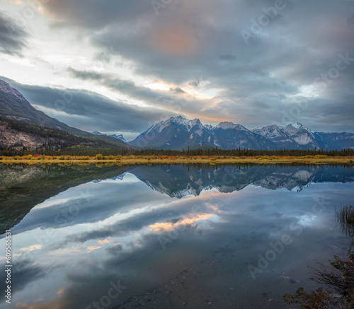 Landscape with mountain range reflecting in a lake at sunset, Jasper National Park, Canada