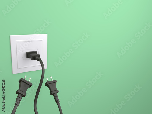 Type-A electric plug isolated on a green background. One plug has been plugged in socket photo