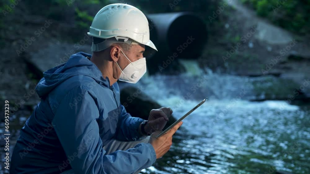 Engineer worker checking water quality of river. Wastewater treatment