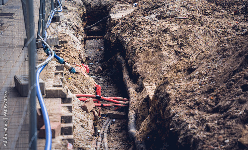 Big construction site with pipes and wires in the construction area. Big construction site with pipes and wires in the construction area.