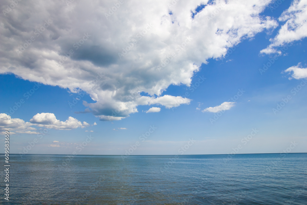 Landscape with view of sea and blue sky with dramatic clouds