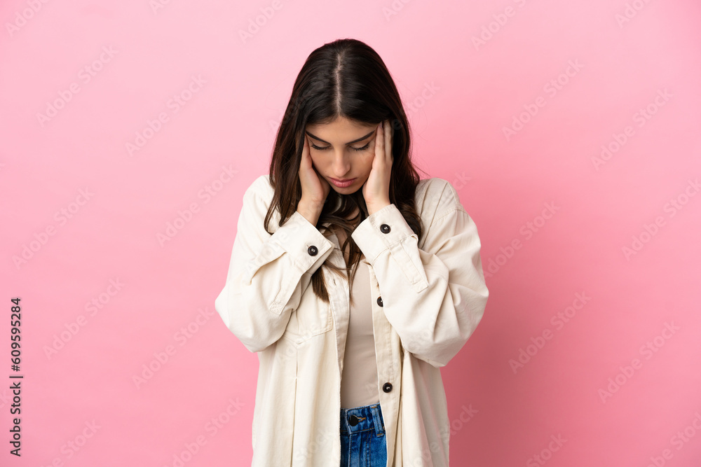 Young caucasian woman isolated on pink background with headache Young caucasian woman isolated on pink background with headache