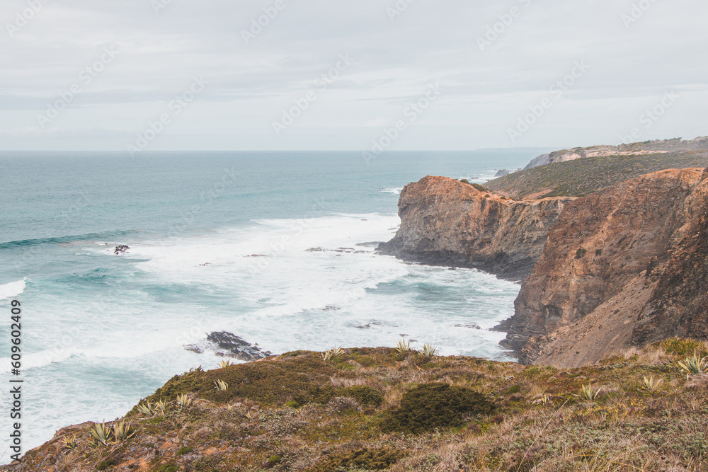 Portugal's western coastline of rocky cliffs and sandy beaches in the Odemira region. Wandering along the Fisherman trail on rainy days