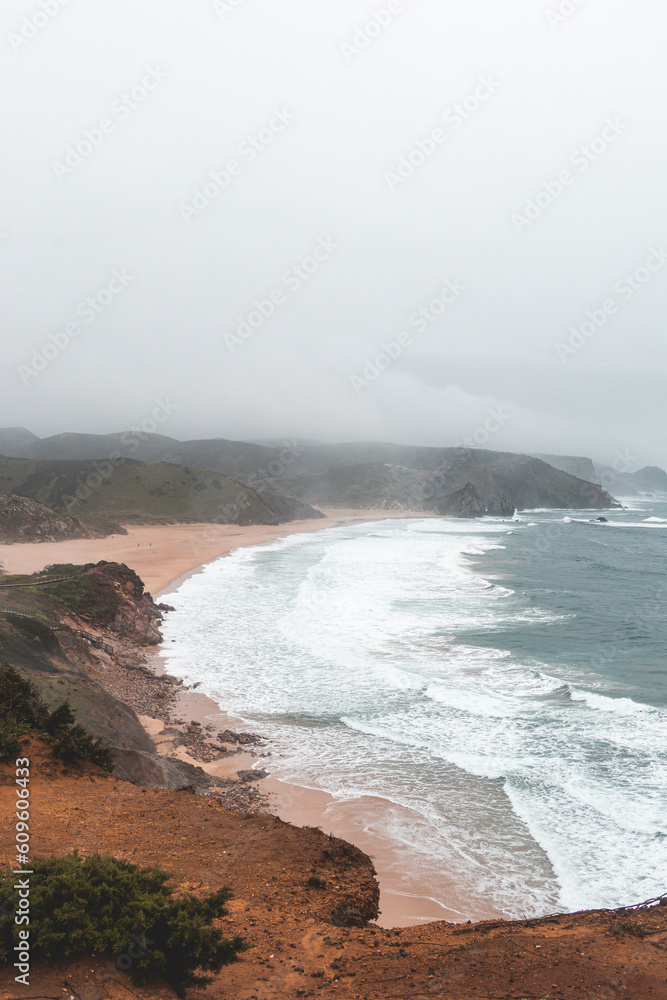 Portugal's western coastline of rocky cliffs and sandy beaches in the Odemira region. Wandering along the Fisherman trail on rainy days