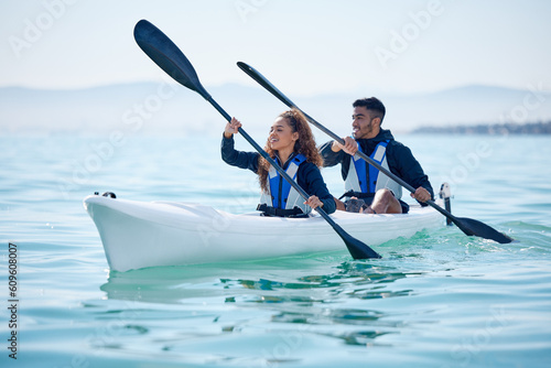 Kayak, couple and rowing boat on lake, ocean or river for water sports and fitness challenge. Man and woman with a paddle for adventure, exercise or travel in nature with freedom, energy and teamwork