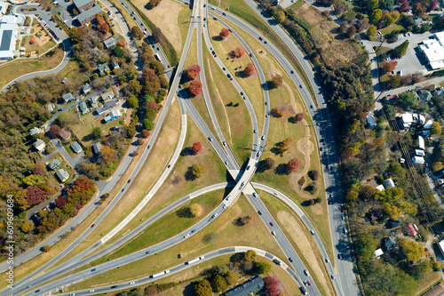 Aerial view of american freeway intersection in fall season in Asheville, North Carolina with fast moving cars and trucks. USA transportation infrastructure concept