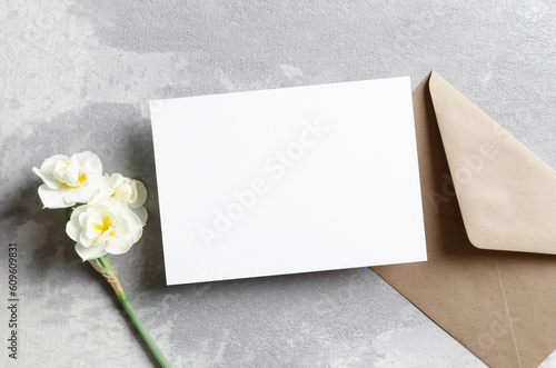 Wedding invitation card mockup with envelope and daffodils flowers