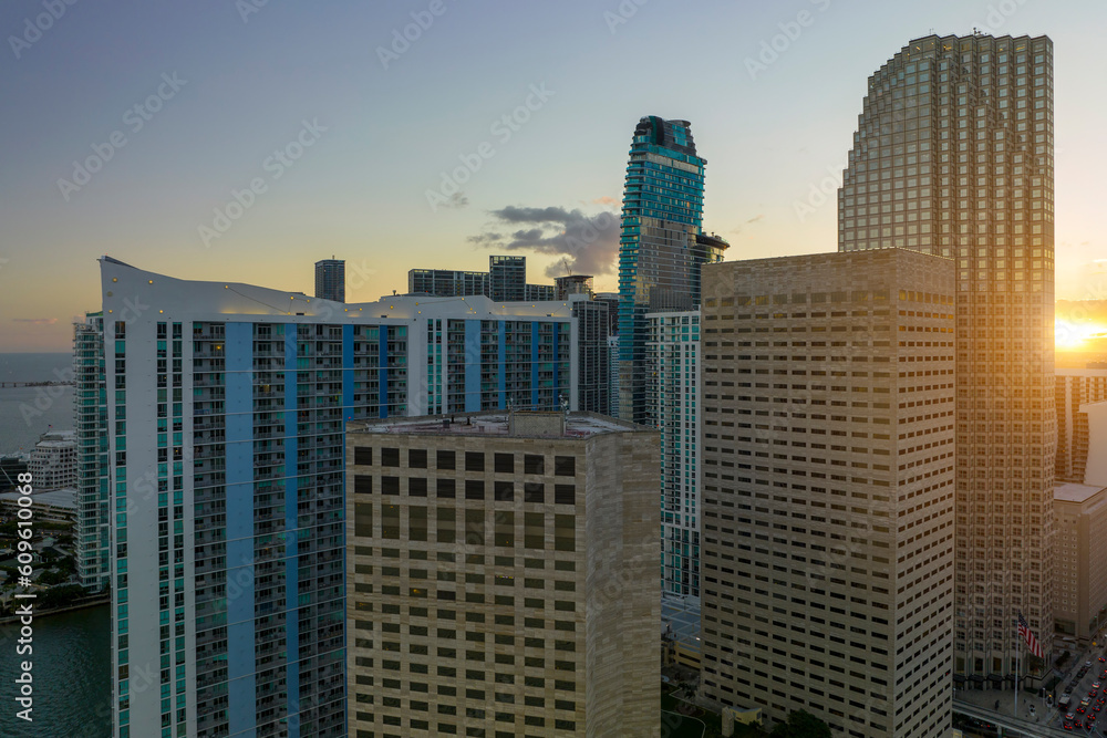 Aerial view of downtown office district of of Miami Brickell in Florida, USA at sunset. High commercial and residential skyscraper buildings in modern american megapolis