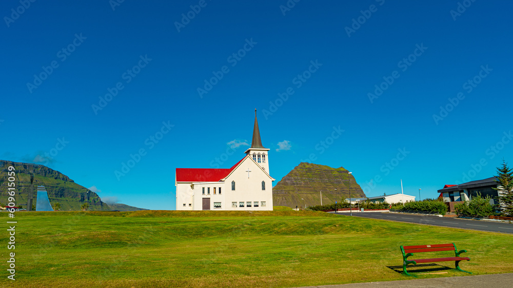 Grundarfjordur, Iceland -  Icelandic church in Western Iceland, at blue sky and sunny day