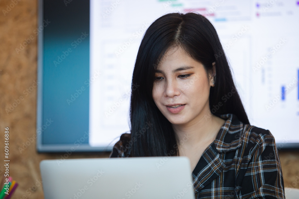 Asian businesswoman using laptop computer, working at office. Female office worker relax time. freelance professional success work. Asian businesswoman using laptop computer, working at office. Female office worker relax time. freelance professional success work.