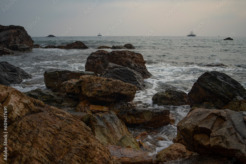 photo of a beach and waves motion at the beach daylight good for background