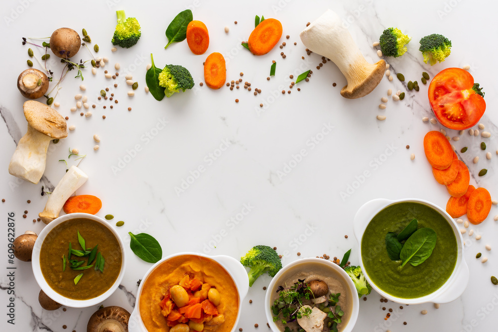 Mushroom and lentil cream soup, bean, carrot and tomato soup, broccoli and spinach soup on white background with cooking ingredients Mushroom and lentil cream soup, bean, carrot and tomato soup, broccoli and spinach soup on white background with cooking ingredients