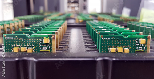 Electronics Manufacturing Services, Assembly Of Circuit Board arrangement, close-up of the raw of PCBA in tray.