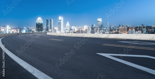 Asphalt pavement and urban building skyline © 昊 周