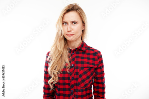 Portrait angry blonde young woman isolated on white studio background, showing negative emotions