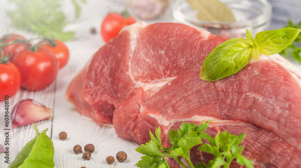 a large piece of fresh meat with herbs and spices a large piece of fresh meat with herbs and spices