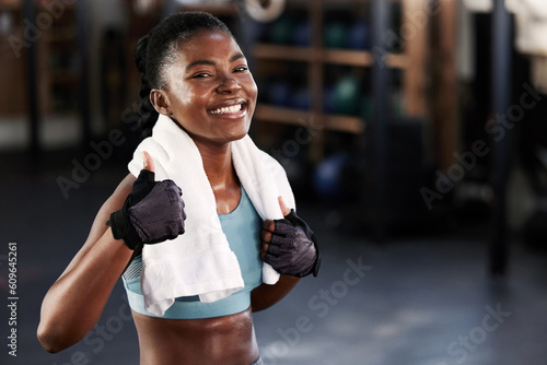 Gym, portrait or happy black woman with thumb up in fitness training with positive mindset or motivation. Encouragement, workout or excited personal trainer with like hand sign, support or thumbs up