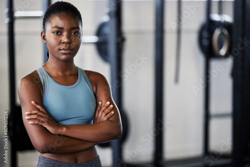 Fitness, portrait or black woman at gym with arms crossed ready for a workout, exercise or training for health. Face of sports girl or serious athlete with strong mindset, resilience or confidence