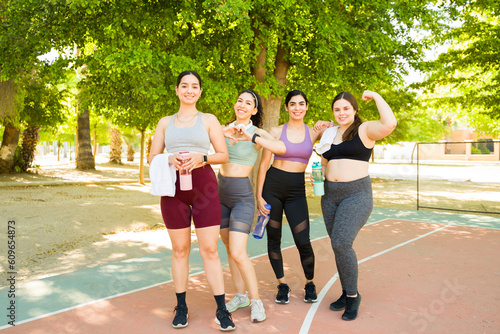 Full length of diverse women working out outdoors