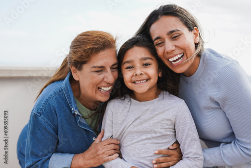 Tablou pe pânză Happy latin multi generational family having tender moment together outdoor - Fe
