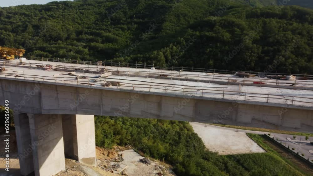 Highway bridge under construction. Aerial view of nes road. Freeway being built on a mountain terrain.. Highway bridge under construction. Aerial view of nes road. Freeway being built on a mountain terrain..