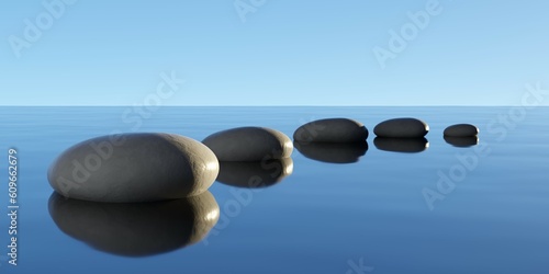 Row  bow or line of black pebbles with water on blue sky background  zen  spa  yoga or meditation concept
