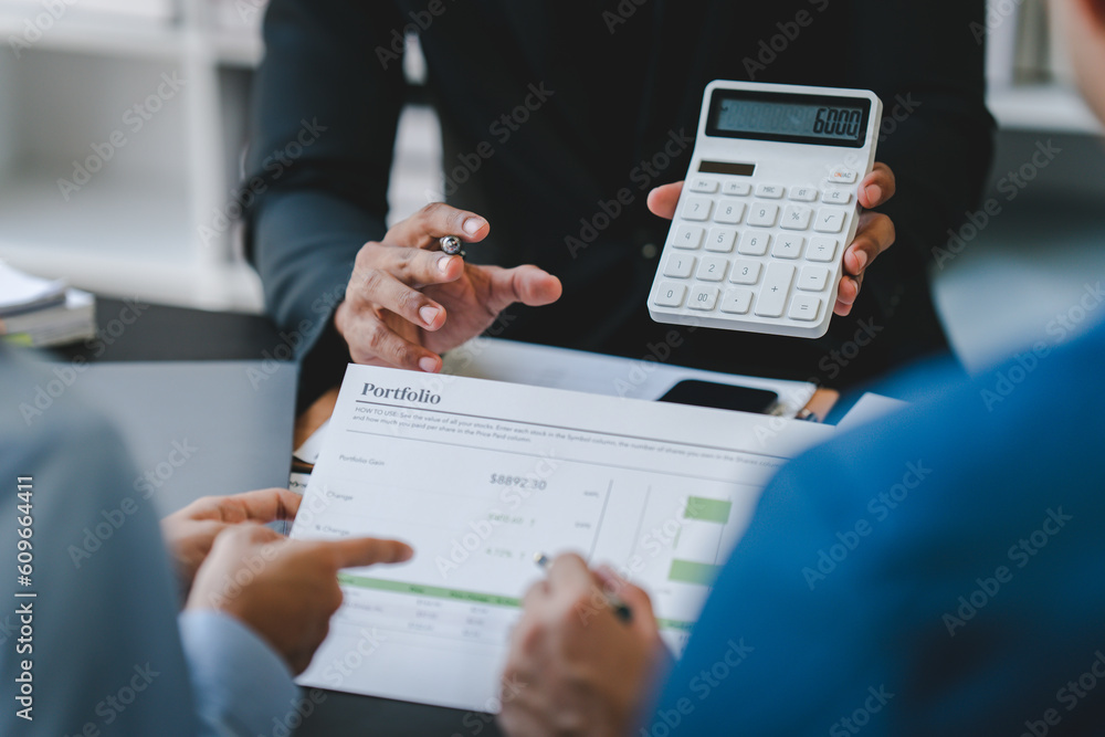 Young colleagues discussing business and charts in office room. Analyze, finance, accounting, tax, marketing, teamwork concept. Young colleagues discussing business and charts in office room. Analyze, finance, accounting, tax, marketing, teamwork concept.