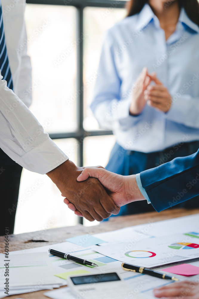 business handshake concept Portrait of two colleagues holding hands A successful deal after a good meeting. business handshake concept Portrait of two colleagues holding hands A successful deal after a good meeting.