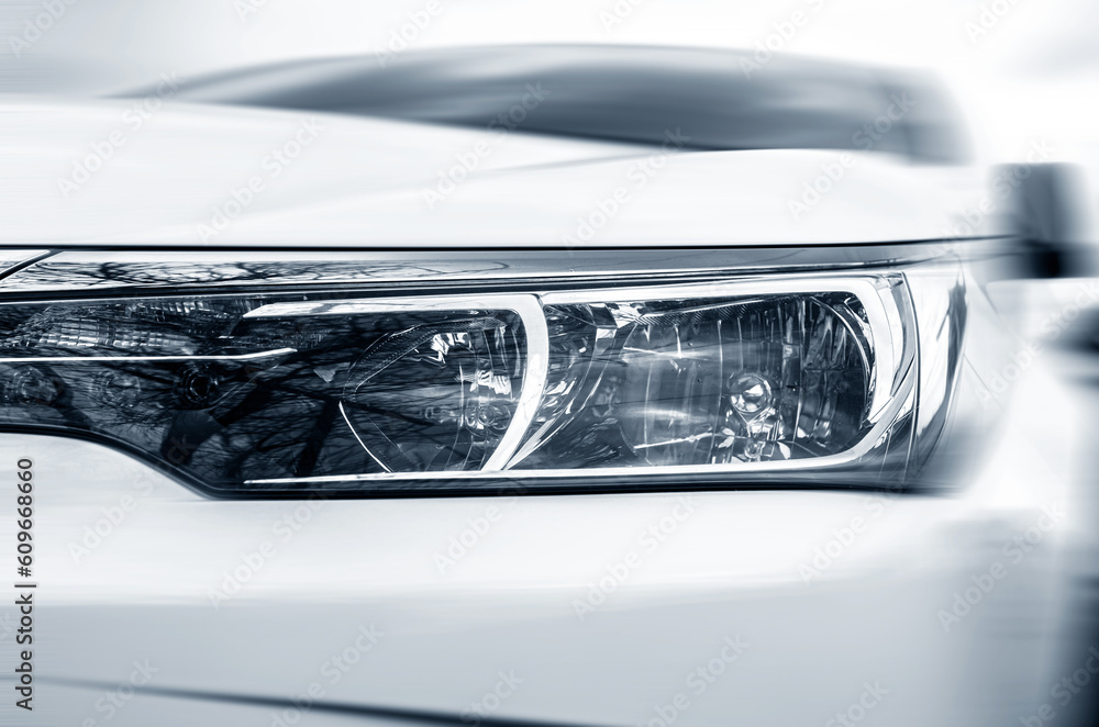 Car headlight close-up with motion effect.