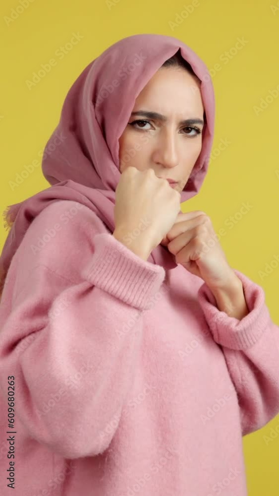 Rude muslim girl boxing looking at camera Rude muslim girl boxing looking at camera