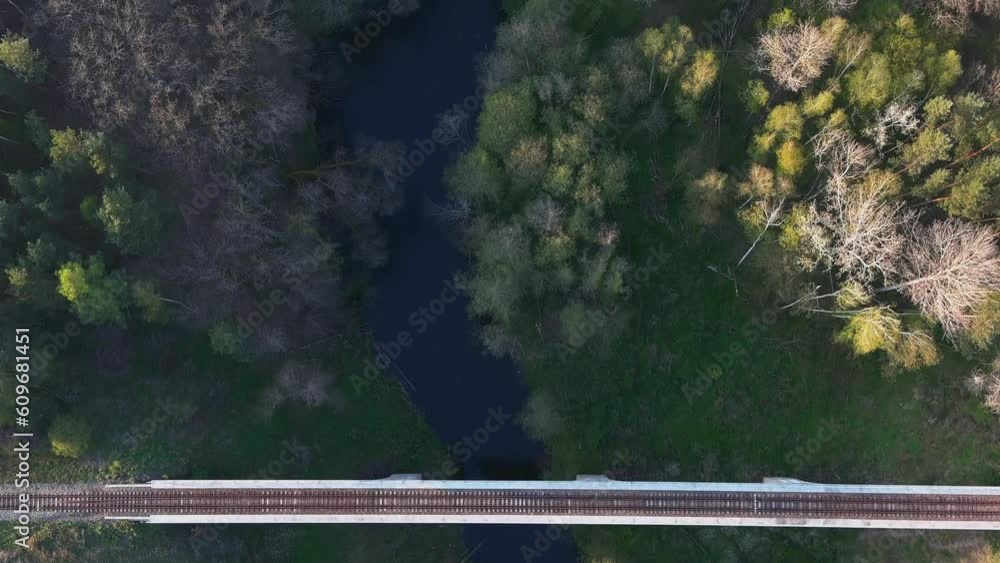drone shot of a railway arched bridge in the forest drone shot of a railway arched bridge in the forest