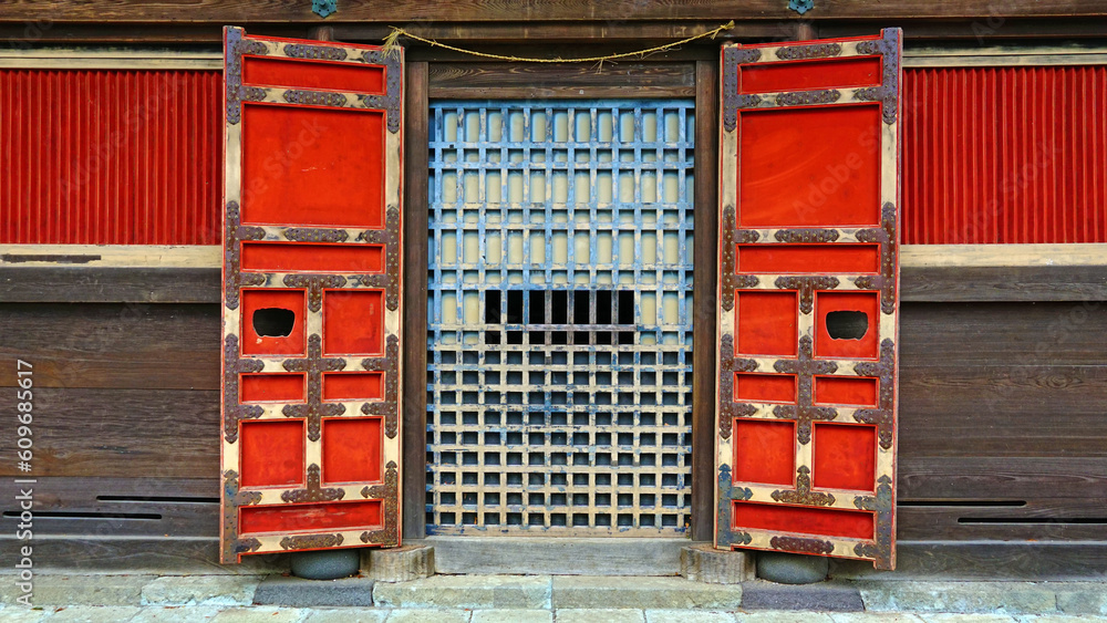 ancient red wooden door inside the temple