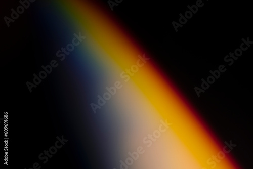 analogic light leak produced with glass crystal and led lights, background is pure black. Perfect for overlays.