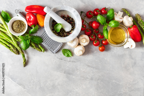 Εκτύπωση καμβά Food cooking ingredients background with fresh vegetables, herbs, spices and olive oil on white stone table top view