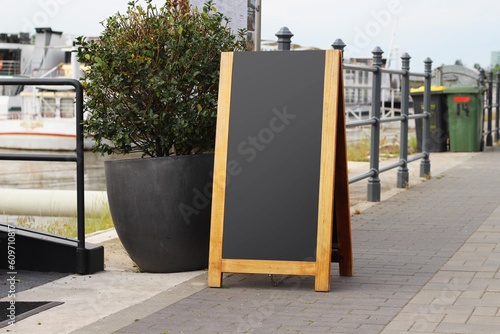 Empty menu board on a street, blank restaurant or cafe sandwich chalkboard.