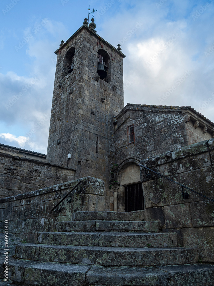 View of the bell tower and the Romanesque church of San Esteban in the village of Allariz in the province of Ourense, Spain, summer of 2021