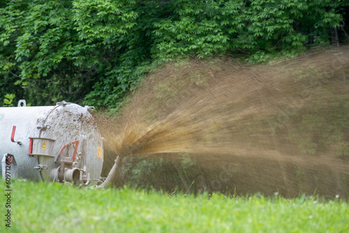 Spreading liquid manure . Gülle ausbringen photo