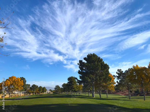 Golf fairway with clouds and sky