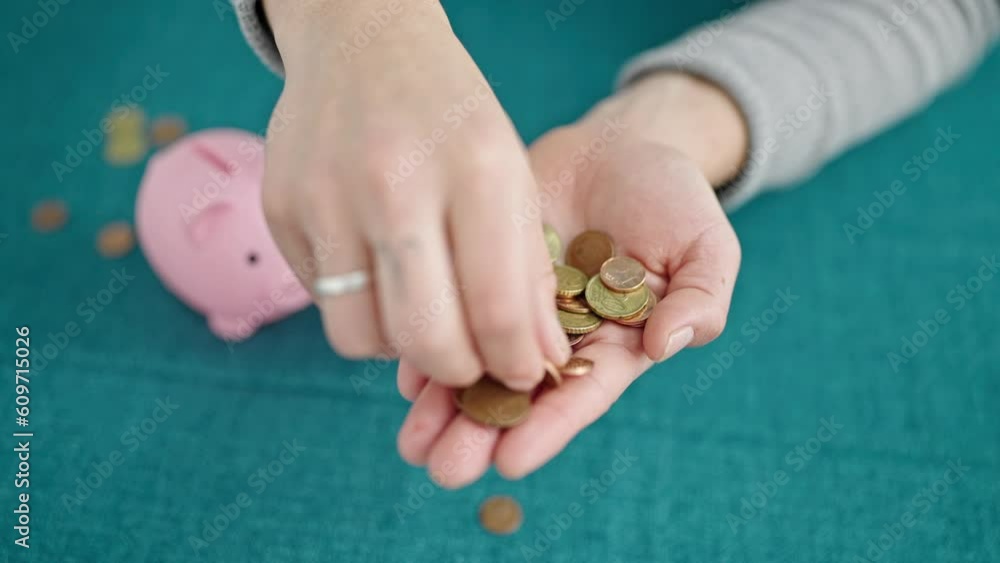 Hispanic man holding coins in the hand at dinning room Hispanic man holding coins in the hand at dinning room
