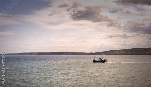 Trawler heading out to sea. © Jack Cousin